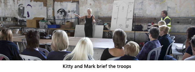 Kitty and Mark brief the troops